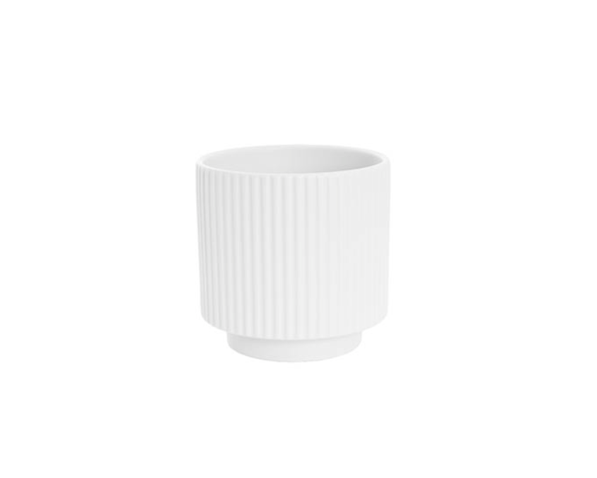 White ceramic pot with ribbed texture on a white background